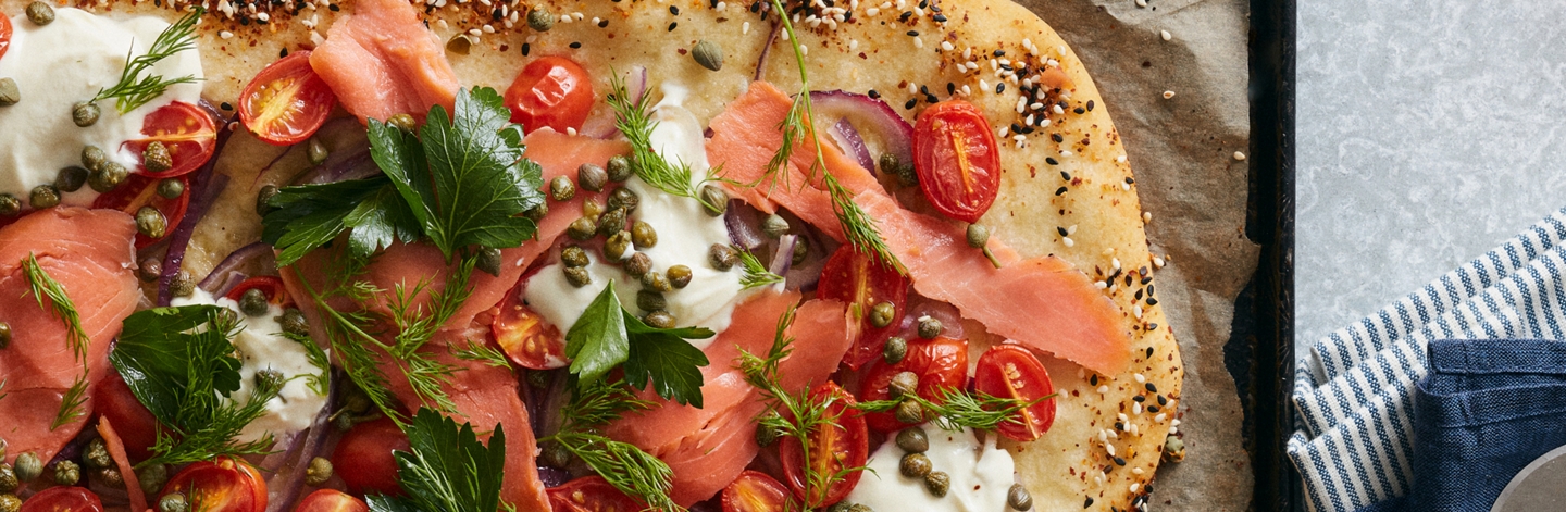Smoked Salmon Pizza with Whipped Goat Cheese, Capers, and Tomato
