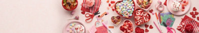 Valentines candies, scissors, markers, paper