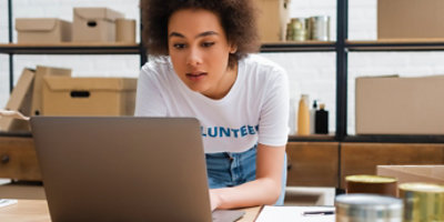  Volunteer looking at laptop