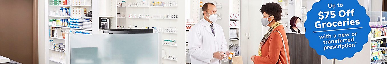Pharmacist consulting with customer at pharmacy.
