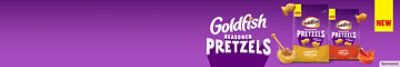 Two bags of Goldfish Seasoned Pretzels on a purple background.