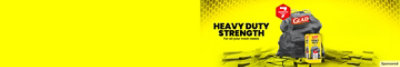Black Glad trash bag with package on yellow background. Headline: Heavy duty strength.