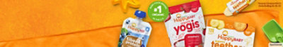 Banner ad featuring Happy Baby Organics snacks and pouches arranged on an orange beach blanket.