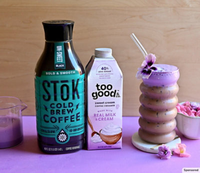 SToK and Too Good products with a coffee drink garnished with flowers.