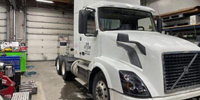 Safeway freight truck in truck shop.