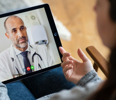 Medical professional on iPad screen.