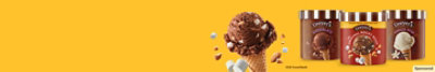 Dreyers ice cream tubs and ice cream cone on an orange background.