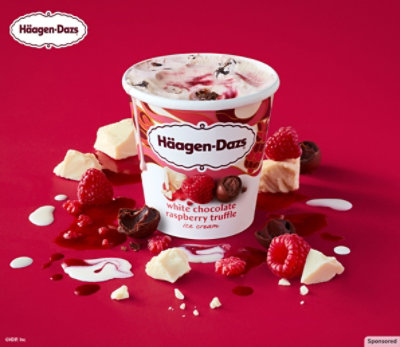 Häggen-Dazs White Chocolate Raspberry Truffle ice cream on a table with ingredients.