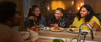Group of people having dinner together