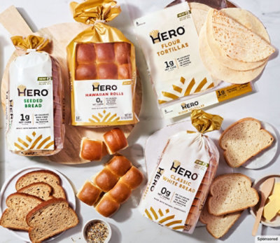 Assortment of breads on a marble countertop. 