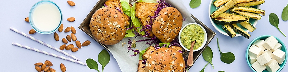 Plant based burgers with a side of tofu and grilled vegetables