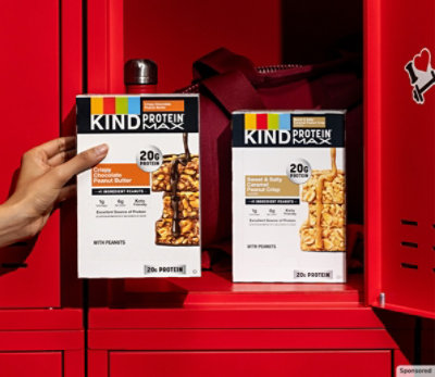 KIND Protein Max bars in a 4-pack box on red background.