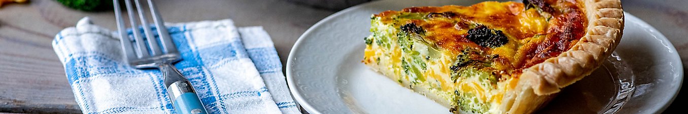 Slice of quiche on a plate.