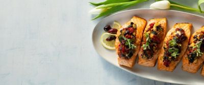 Plate of garnished Salmon next to two tulips