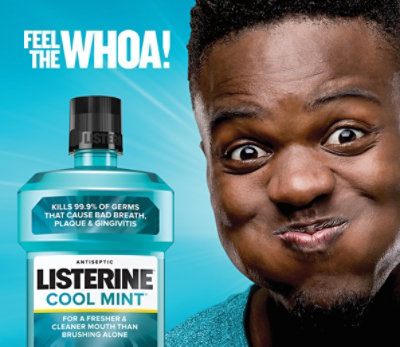 Feel the Whoa! Man smiles as he rinses with Listerine Cool Mint mouthwash.