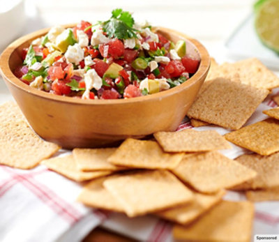 A bowl of Strawberry Salsa with WHEAT THINS Crackers.
