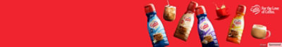 Coffee mate packages on a red background.