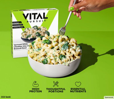 Bowl of brocoli pasta with a Vital Pursuit box on a green background