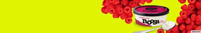 Raspberry Noosa yoghurt on yellow background with fresh raspberries.  