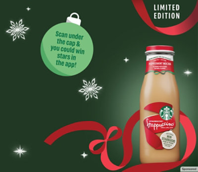 Starbucks Frappucino bottle with a red ribbon and snowflake decorations.