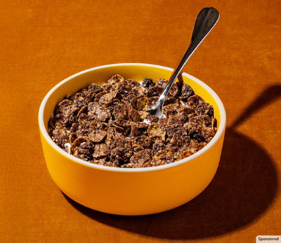 A bowl of Chocolate Honey Bunches of Oates.