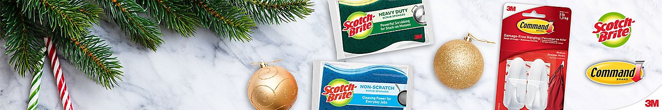 Scotch-Brite sponges and Command hooks placed next to winter holiday decors.