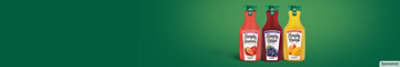 Three bottles of Simply fruit drink on a green gradient background.