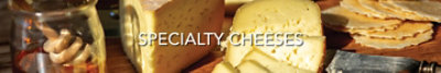 Various blocks of cheese with the text "Specialty Cheeses".