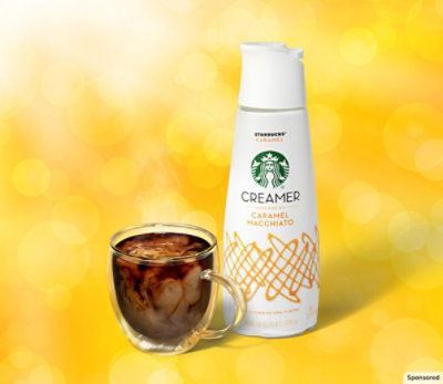 Starbucks® Caramel Macchiato creamer with a glass mug of black coffee with creamer swirled in.