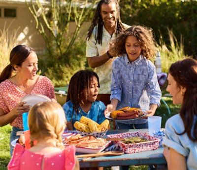 Family outdoors eating