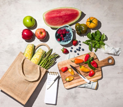 fruits and veggies with cutting board 