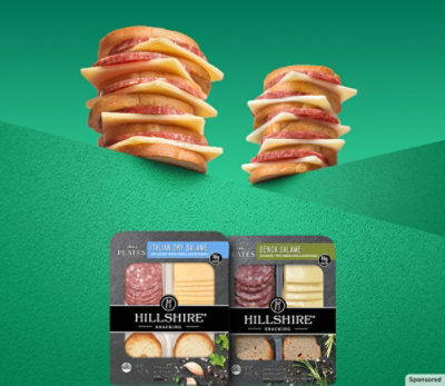 Two stacks of tasty meat, cheese and crackers.