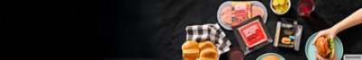 Impossible® plant-based Ground Beef & Violife® Just Like Cheddar dairy free cheese slices on dark background.